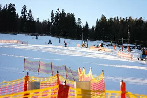 Empty ski slope at the beginning of the day. Stock Photos