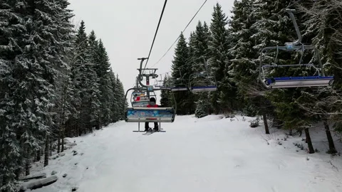 Empty Skilifts Moving On The Ropeway Above Ski Slope In Austrian Alps With Stock Footage 139889383