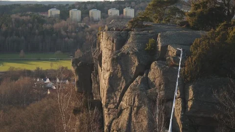 Empty Slackline hanging over Cliff in Gothenburg, Sweden at Sunset, Medium shot Stock-Footage 255109318