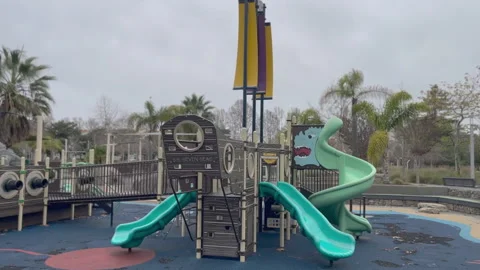 An Empty Slides in a Children's Park on A Cloudy Day Video stock 230192639