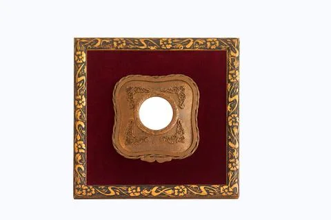 Empty small antique frame in gilded wood bordeux velvet on white background Stock Photos