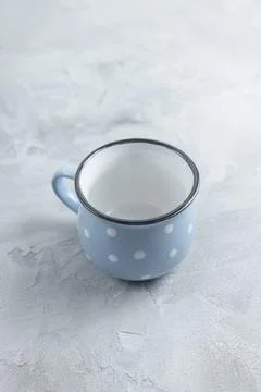 Empty small coffee cup on gray background Stock Photos