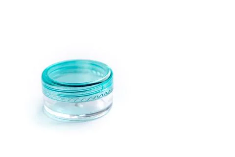 Empty small plastic or glass jar for beauty cream on white background. Acryli Stock Photos