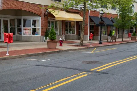 Empty Small town without vehicles or people. The parking meters where covered Stock Photos