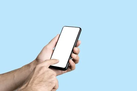Empty smartphone in hand on colored blue banner background. Mockup phone with Stock Photos