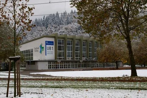 Empty snow-covered square in front of the University library. Quite urban scene. Stock Photos