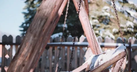 Empty Snow-Covered Swing in Sunny Winter Garden. 4K DCi SLOW MOTION 120 fps. 스톡 동영상 67218171
