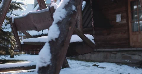 Empty Snow-Covered Swing in Sunny Winter Garden. 4K DCi SLOW MOTION 120 fps. 스톡 동영상 67218307