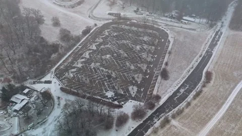 Empty snowy parking lot in Visegrád Mountains with icy winter roads view Stock Footage 340268041