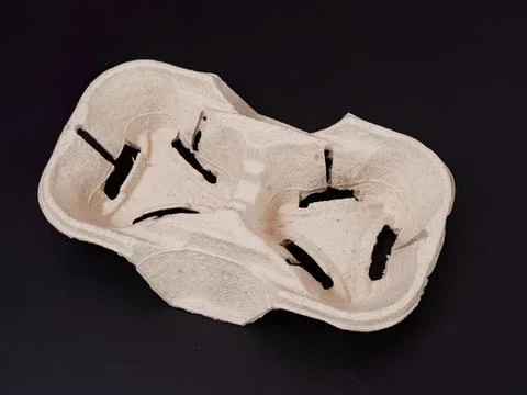 Empty soap dish with black soap residue on black background Stock Photos