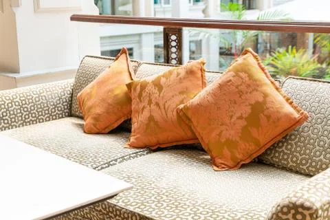 Empty sofa and chair with pillows Stock Photos