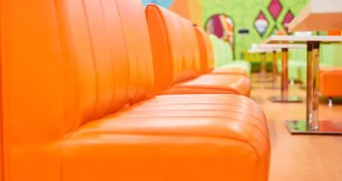 Empty sofas in a cafe, restaurant in a row one Stock Photos
