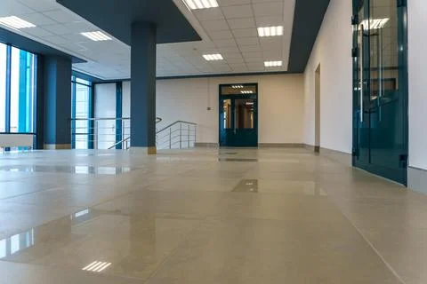 An empty space with railings and large windows. The modern interior of the lo Stock Photos