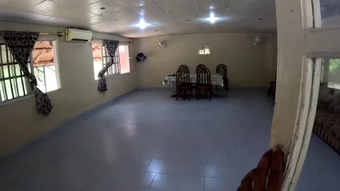 Empty Spacious Living Room with Dining Table and Sofas in Residential House Stock Footage 341392053