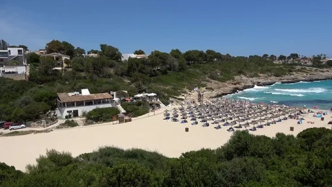 Empty Spanish beach in a small bay in Cala Mandia Mallorca Spain Video stock 81088776