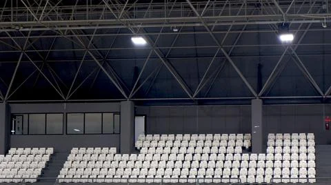 Empty spectator seating rows with building construction Stock Photos