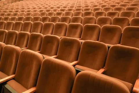 Empty spectator seats in the hall. Background. Stock Photos