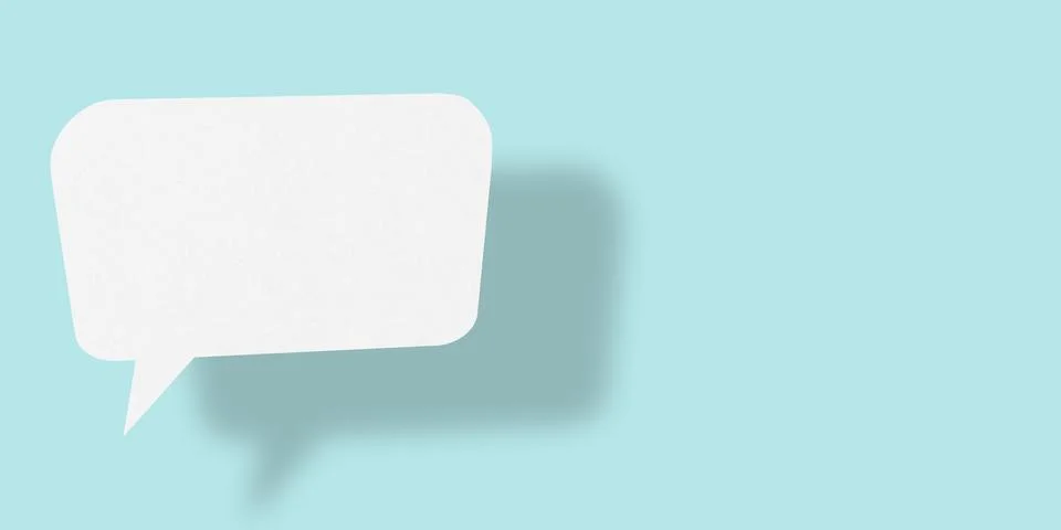 Empty speech balloon shape white paper isolated on light blue background co.. Ilustración de archivo
