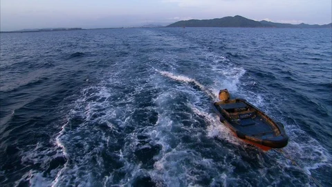 Empty speedboat sailing in the sea at dusk Stock Footage 88889710