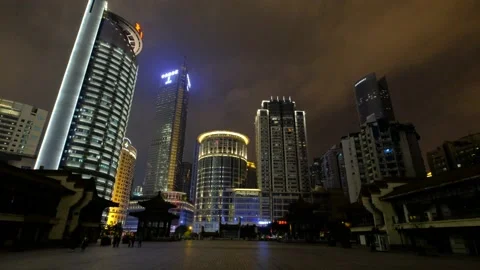 Empty square and tall buildings in the distance at night in Chongqing Stock Footage 146669369