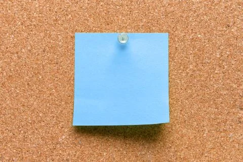 Empty square blue pinned sheet on a brown cork reminder Stock Photos