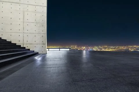 Empty square floor and beautiful city skyline at night in Shanghai. Stock Photos