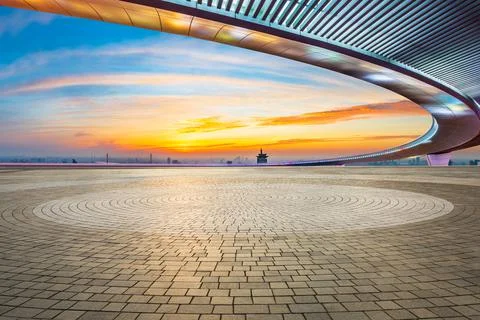 Empty square floor and city skyline at sunset in Shanghai. Stock Photos