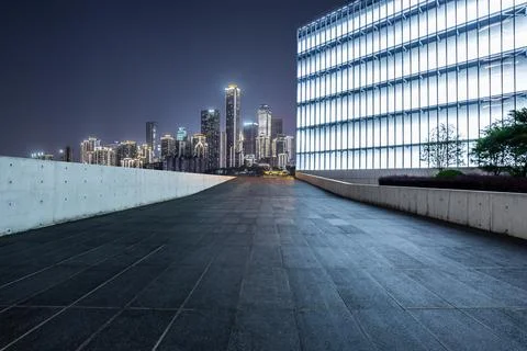 Empty square floor and city skyline with modern commercial buildings. Stock Photos