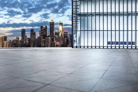 Empty square floor and city skyline with modern commercial buildings. Stock Photos