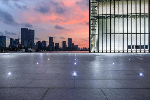 Empty square floor and city skyline with modern commercial office buildings. Stock Photos