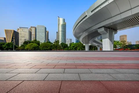 Empty square floor and city skyline with modern commercial buildings. Stock Photos