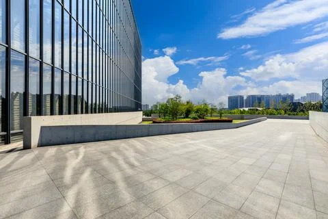 Empty square floor and city skyline with modern commercial buildings. Stock Photos