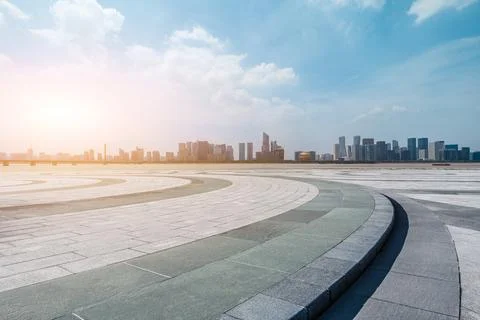 Empty square floor and city skyline with modern commercial buildings. Stock Photos