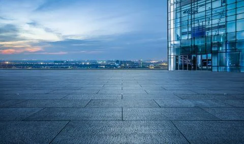 Empty square floor and city skyline with modern commercial buildings. Stock Photos