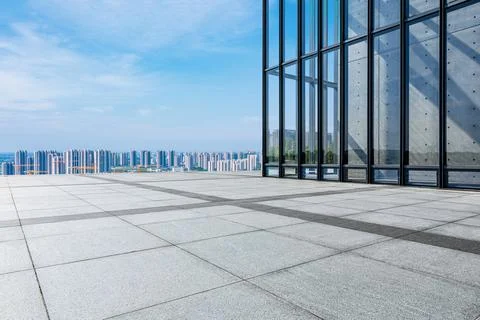 Empty square floor and city skyline with building scenery. Stock Photos