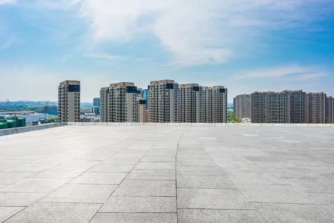 Empty square floor and city skyline with modern commercial buildings scenery. Stock Photos