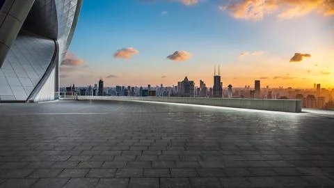 Empty square floor and city skyline with buildings in Shanghai at sunset Stock Photos