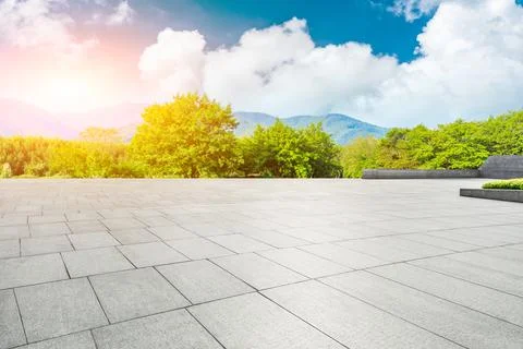 Empty square floor and green mountain background. Stock Photos