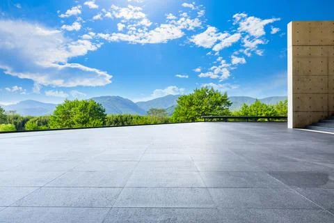 Empty square floor and green mountain background. Stock Photos