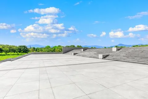 Empty square floor and green mountain background. Stock Photos