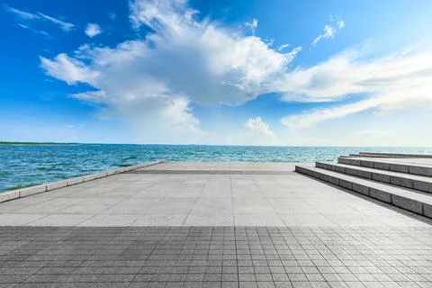 Empty square floor and lake landscape under the blue sky. Stock Photos