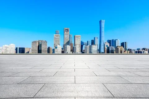 Empty square floor and modern city commercial buildings in Beijing. Stock Photos