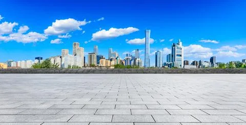 Empty square floor and modern city commercial buildings in Beijing. Stock Photos