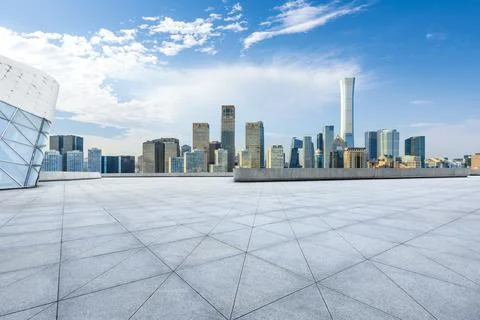 Empty square floor and modern city commercial buildings in Beijing. Stock Photos