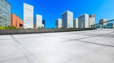 Empty square floor and modern city commercial buildings in Beijing. Stock Photos