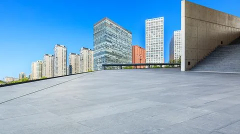 Empty square floor and modern city commercial buildings in Beijing. Stock Photos