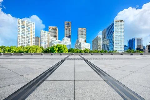 Empty square floor and modern city commercial buildings in Beijing. Stock Photos