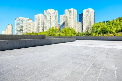Empty square floor and modern city commercial buildings in Beijing. Stock Photos