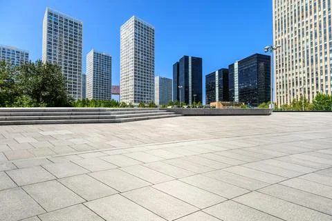 Empty square floor and modern city commercial buildings in Beijing. Stock Photos