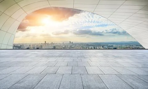 Empty square floor and modern city skyline with buildings at sunset in Ningbo Stock Photos